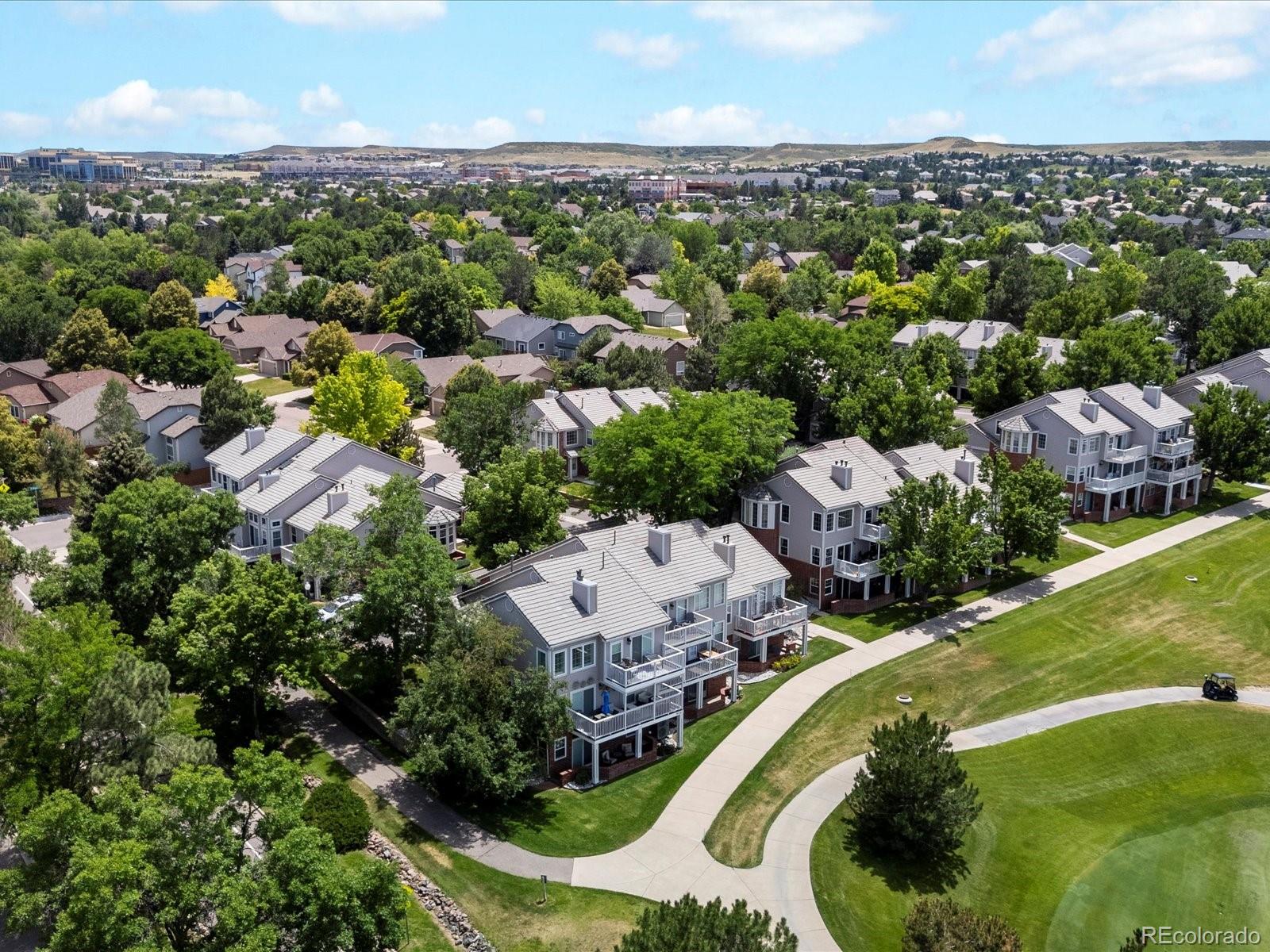 9323 Notts Court Lone Tree, CO 80124 - Photo 41 of 45 an aerial view of a house with a garden and lake view