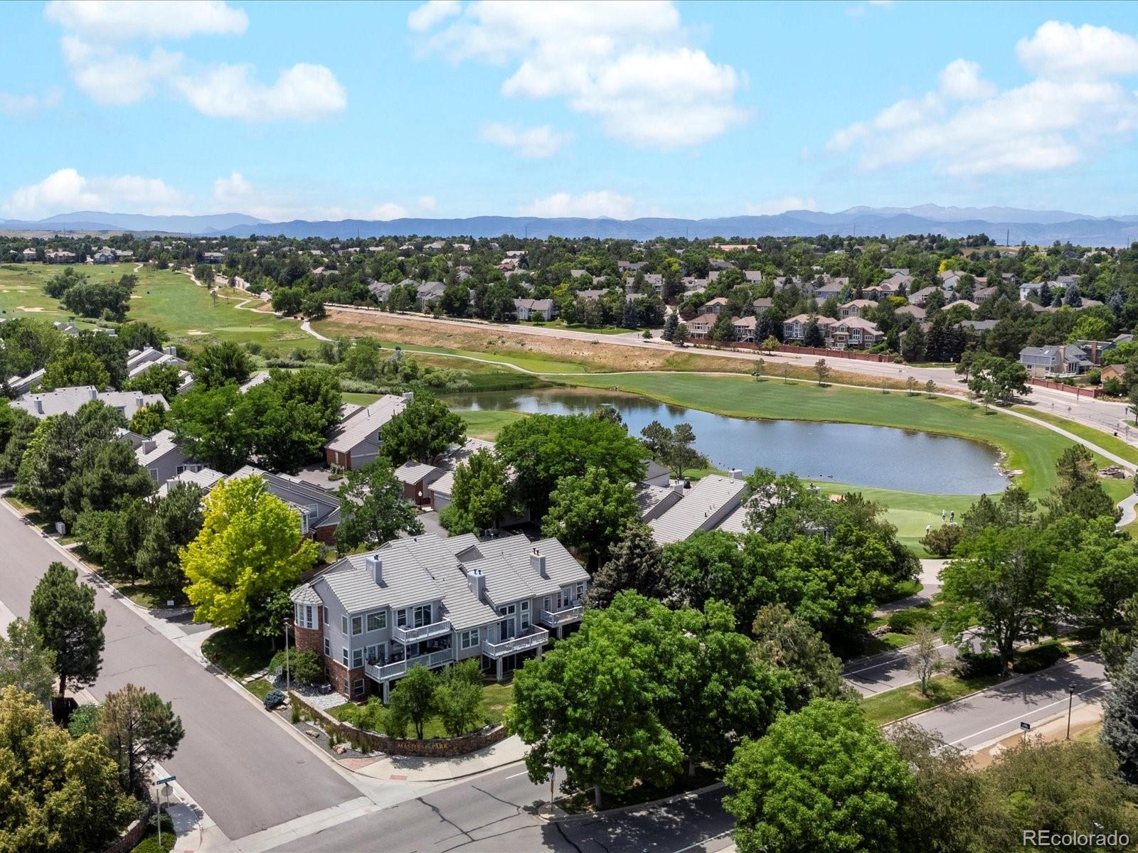 9323 Notts Court Lone Tree, CO 80124 - Photo 42 of 45 an aerial view of a city with lots of residential buildings ocean and mountain view in back