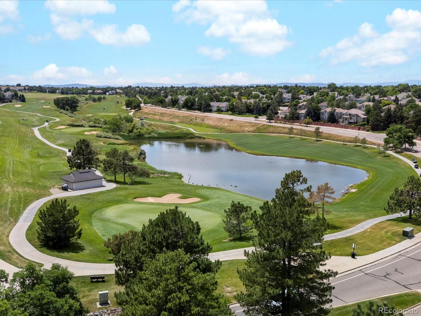 9323 Notts Court Lone Tree, CO 80124 - Photo 43 of 45 a view of a lake with a city
