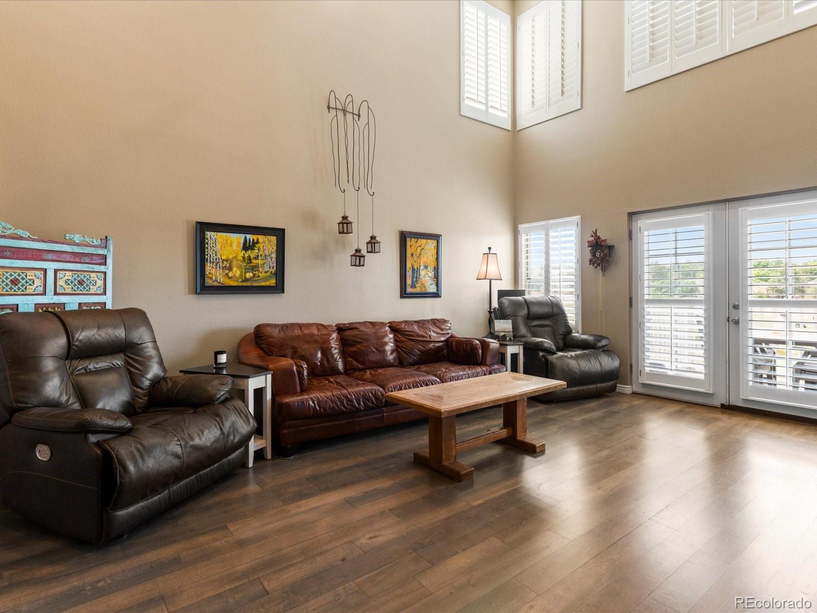9323 Notts Court Lone Tree, CO 80124 - Photo 6 of 45 a living room with furniture and a large window