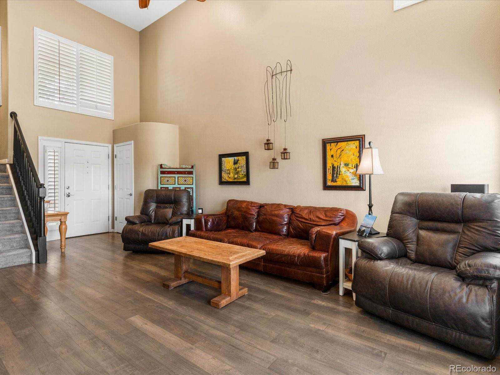 9323 Notts Court Lone Tree, CO 80124 - Photo 7 of 45 a living room with furniture and a flat screen tv