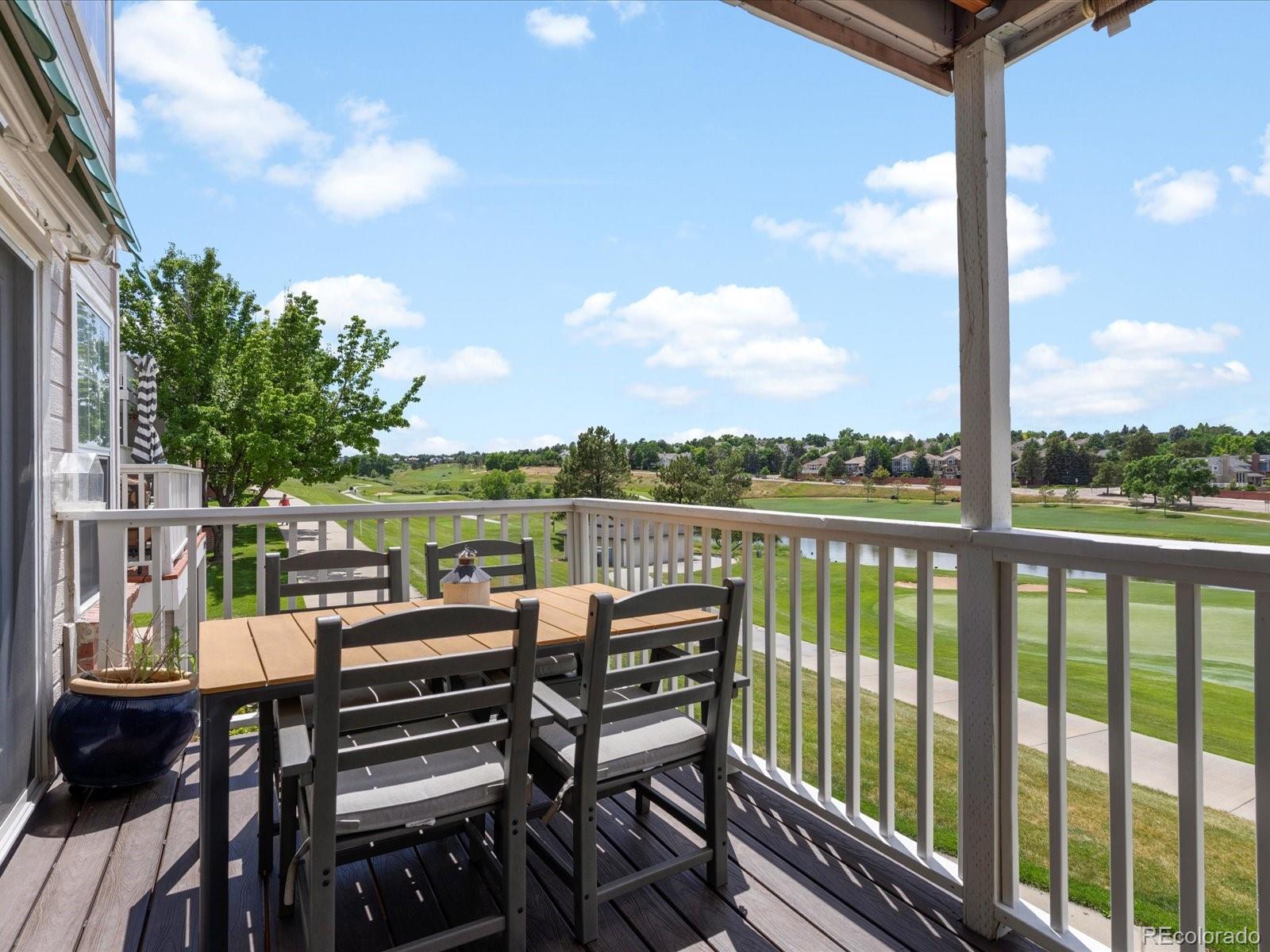 9323 Notts Court Lone Tree, CO 80124 - Photo 8 of 45 a view of a balcony with two chairs and a table
