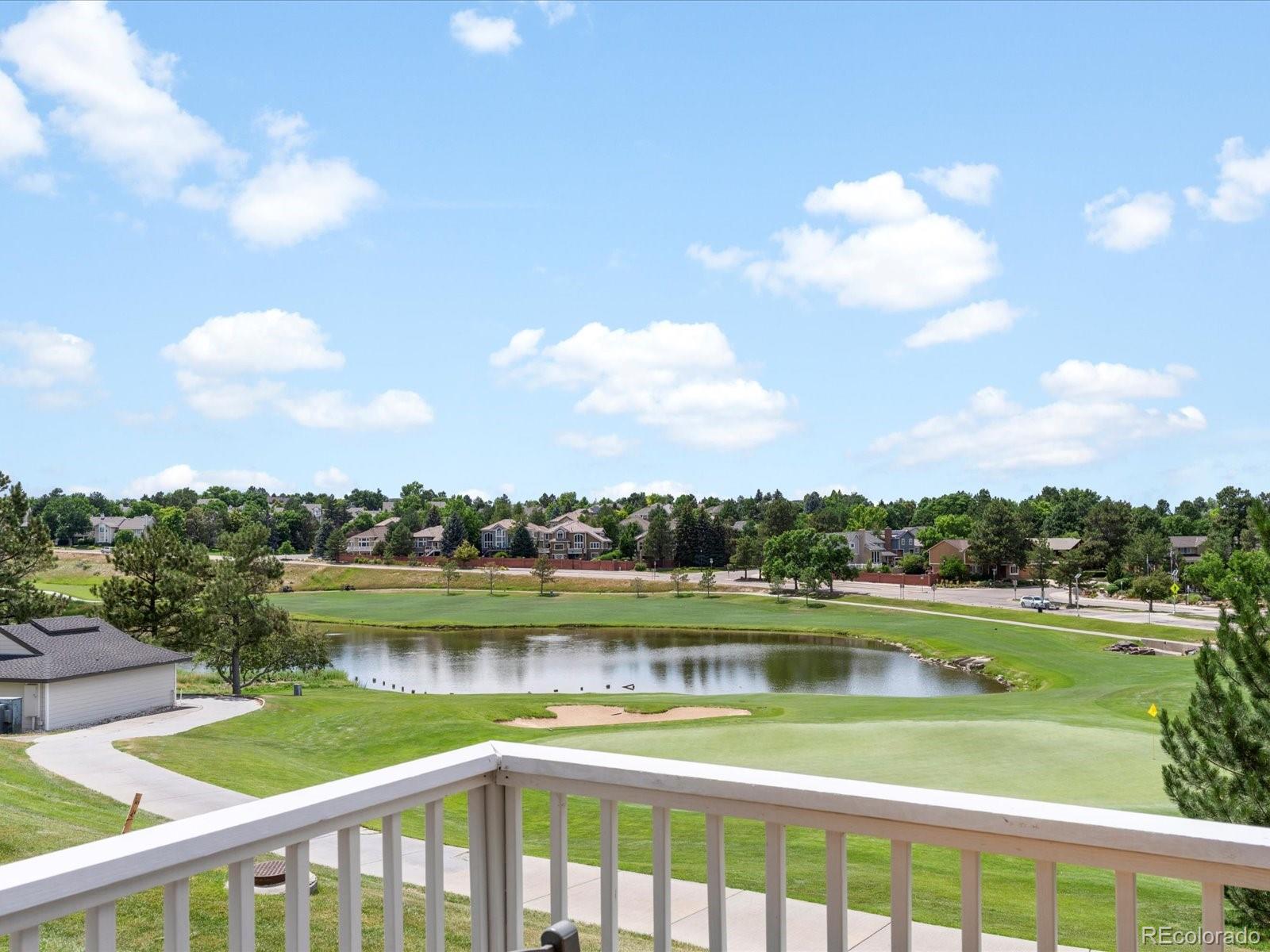 9323 Notts Court Lone Tree, CO 80124 - Photo 9 of 45 a view of swimming pool and lake view