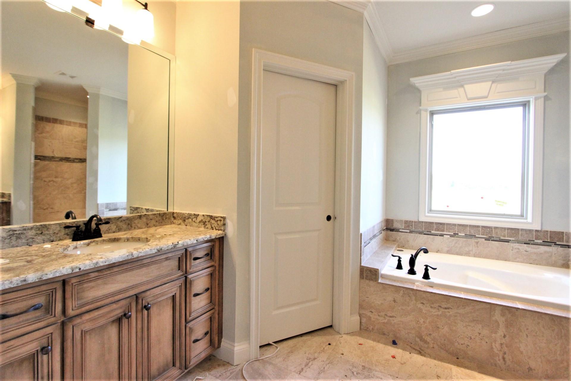 151 Springfield Drive, Unit 57 Lebanon, TN 37087 - Photo 17 of 23 Master Bath With His And Hers Vanities And Granite Countertops