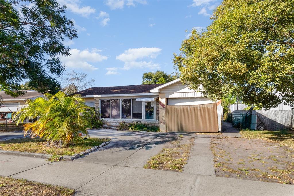 1638 East Main Street Lakeland, FL 33801 - Photo 1 of 16 a front view of house with yard and trees around