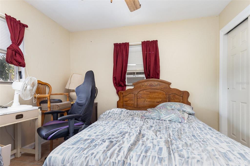 1638 East Main Street Lakeland, FL 33801 - Photo 12 of 16 a bedroom with a bed and a window