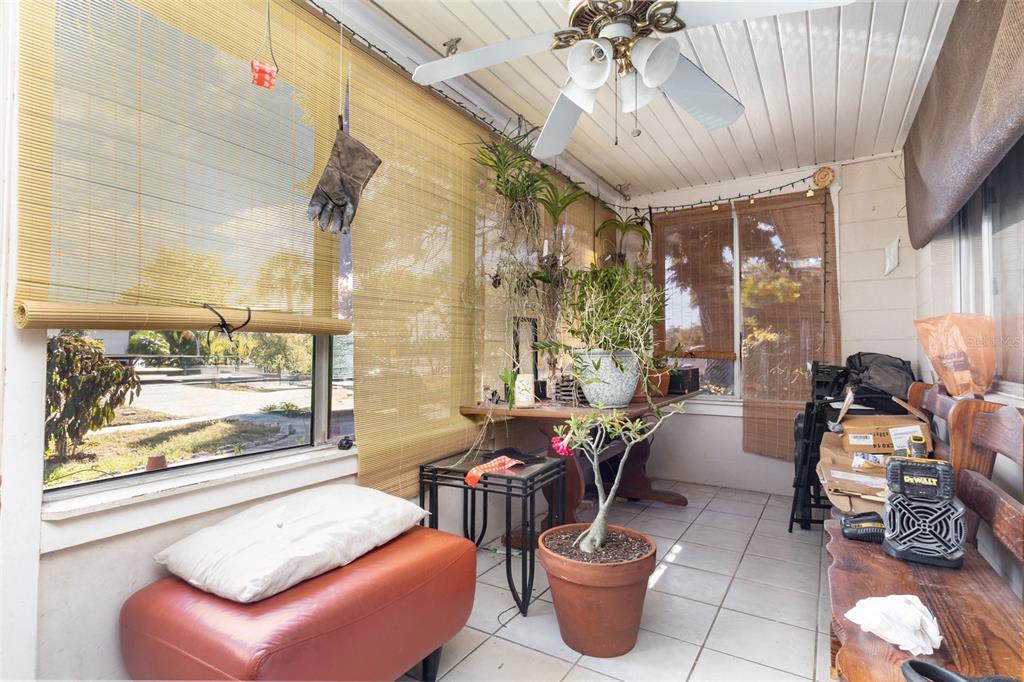 1638 East Main Street Lakeland, FL 33801 - Photo 3 of 16 a living room with furniture a window and a potted plant