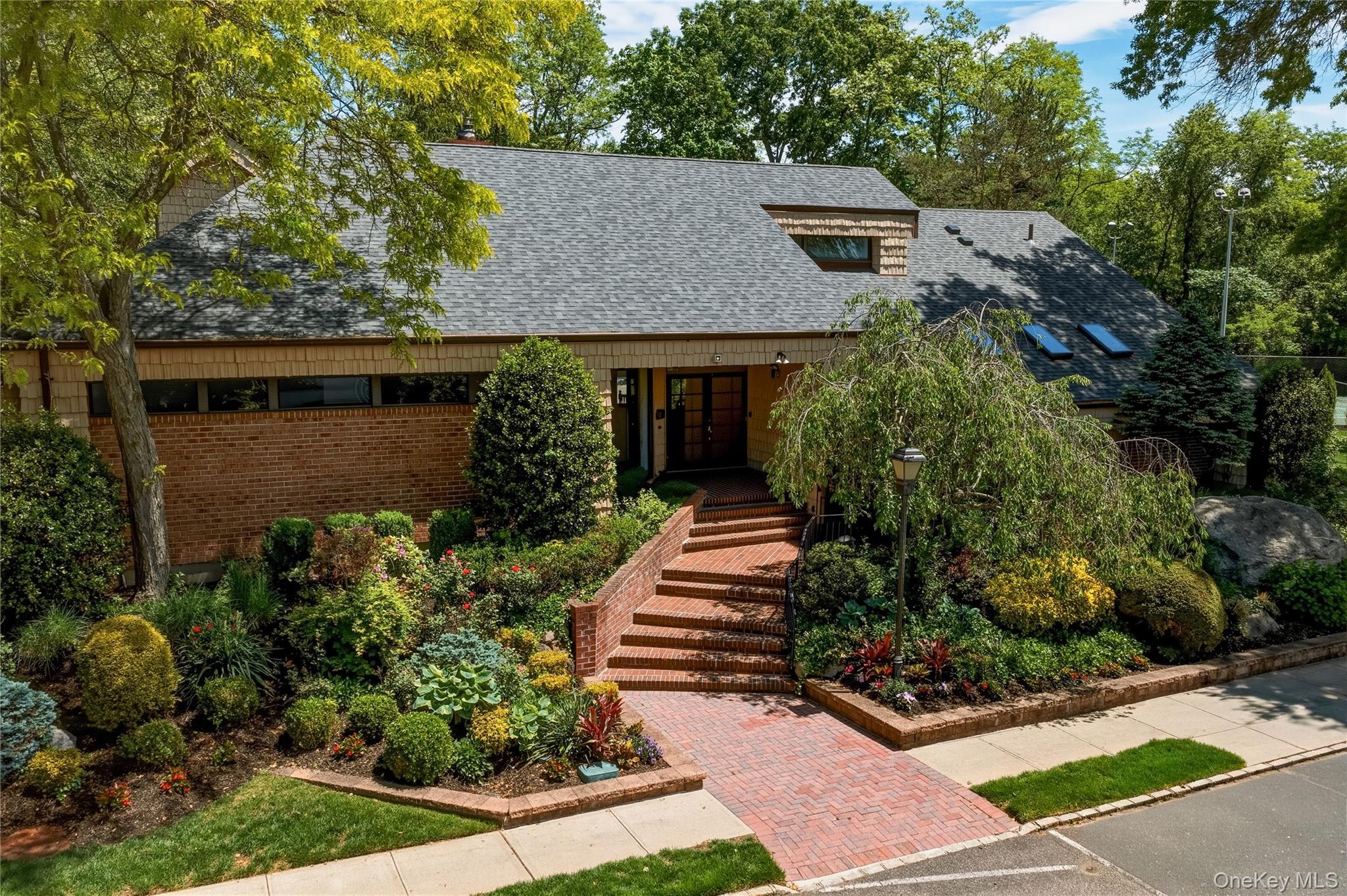 44 Hidden Ridge Drive Syosset, NY 11791 - Photo 25 of 28 front view of house with a yard