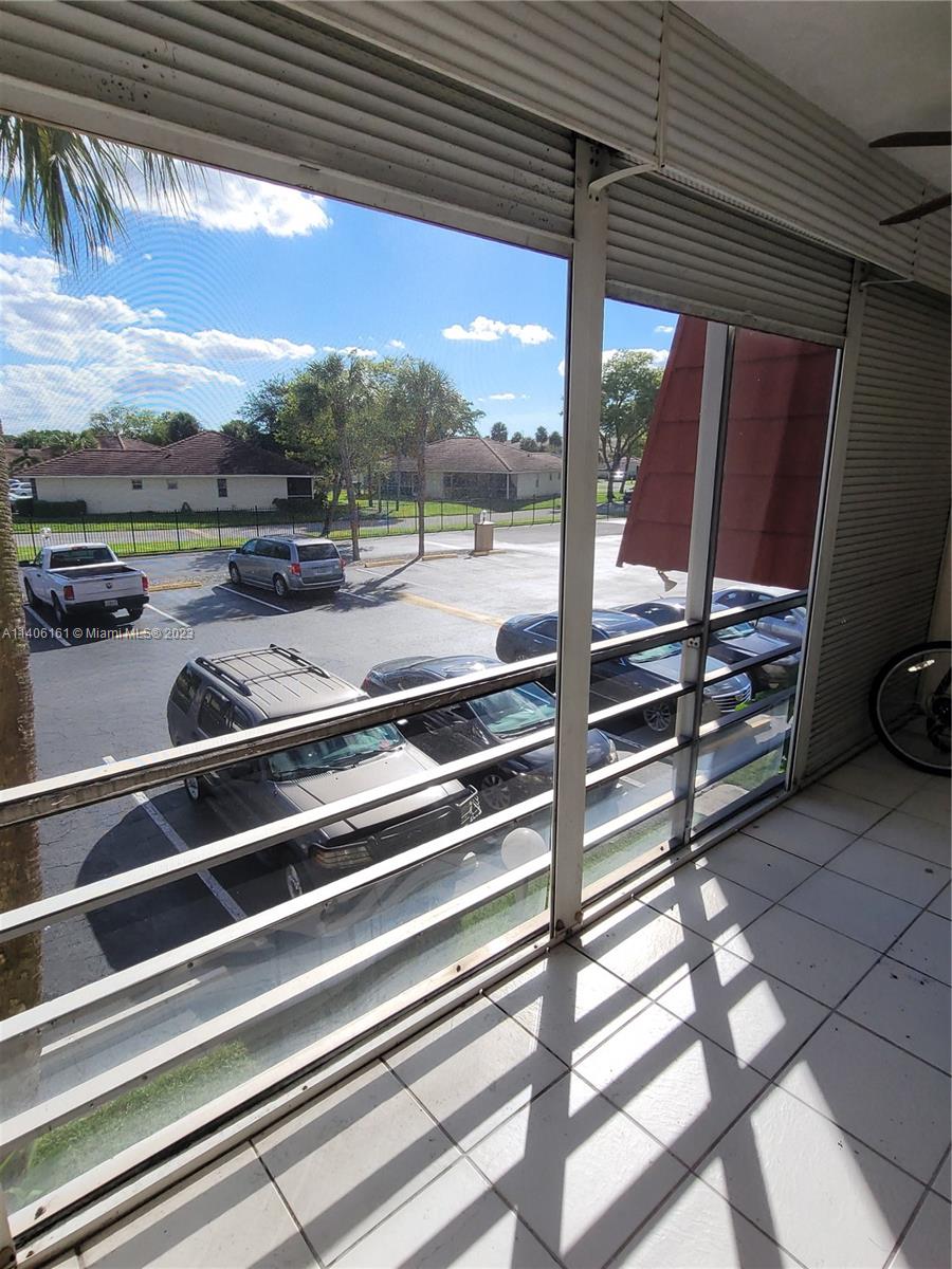 22605 Southwest 66th Avenue, Unit 207 Boca Raton, FL 33428 - Photo 11 of 15 a view of outdoor space with seating area