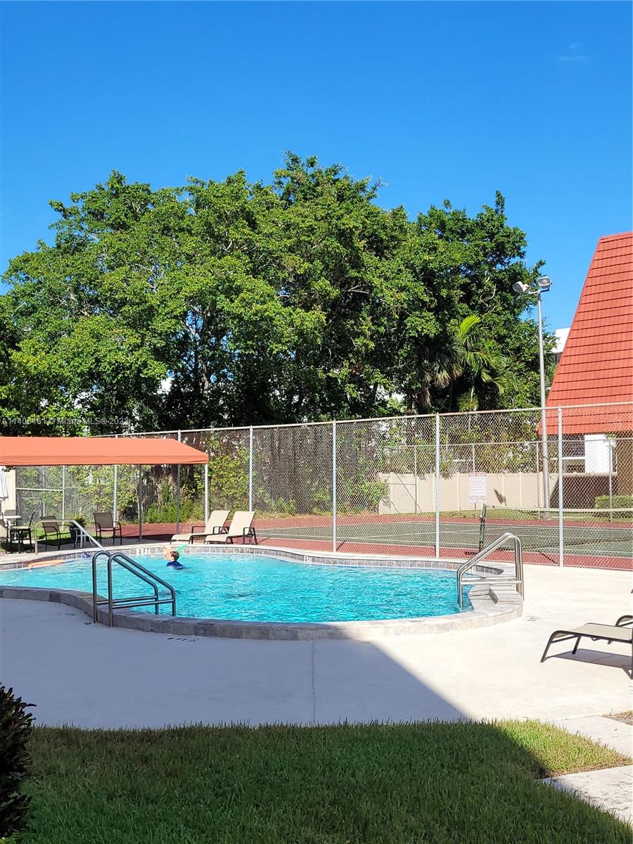 22605 Southwest 66th Avenue, Unit 207 Boca Raton, FL 33428 - Photo 3 of 15 a view of a child park