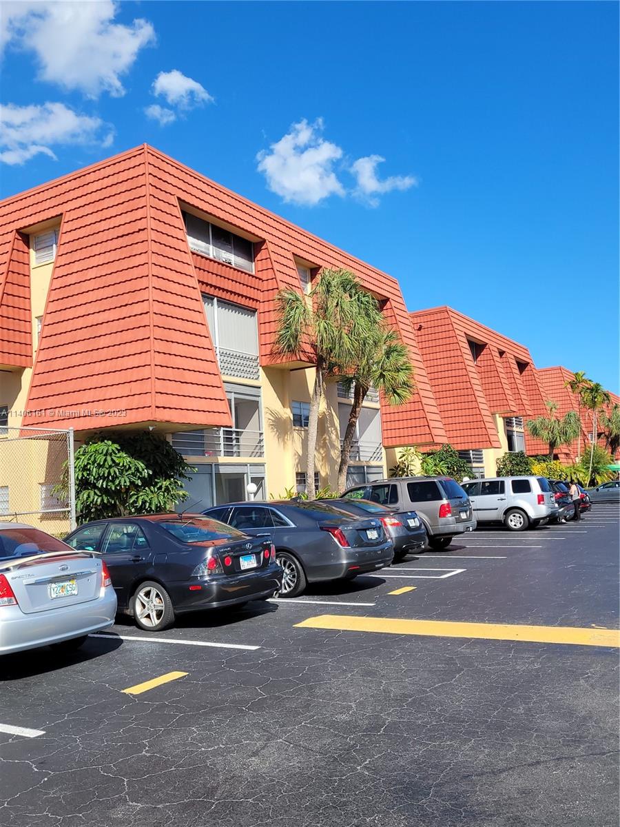 22605 Southwest 66th Avenue, Unit 207 Boca Raton, FL 33428 - Photo 4 of 15 a view of a street with cars