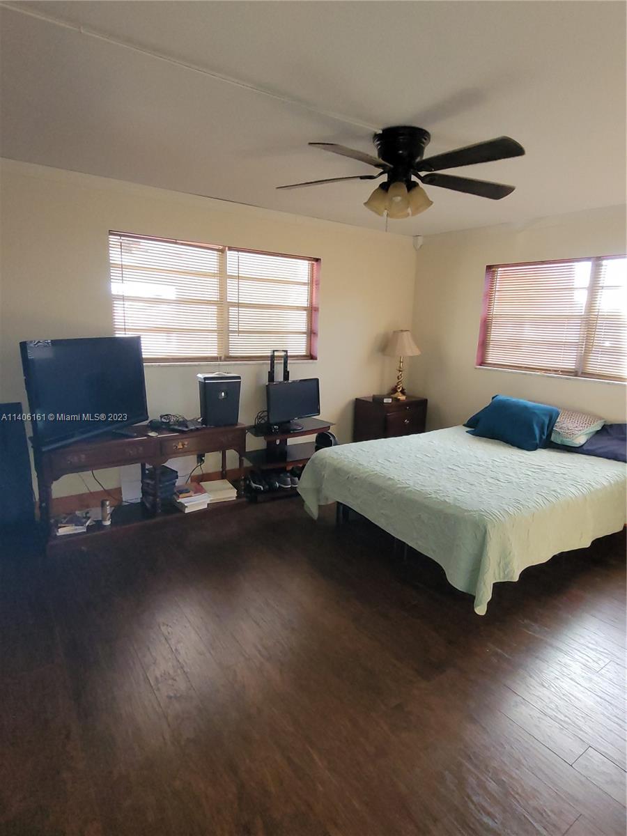 22605 Southwest 66th Avenue, Unit 207 Boca Raton, FL 33428 - Photo 7 of 15 a bedroom with a bed furniture and a window