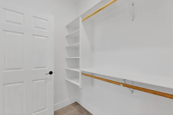 a view of an empty walk in closet