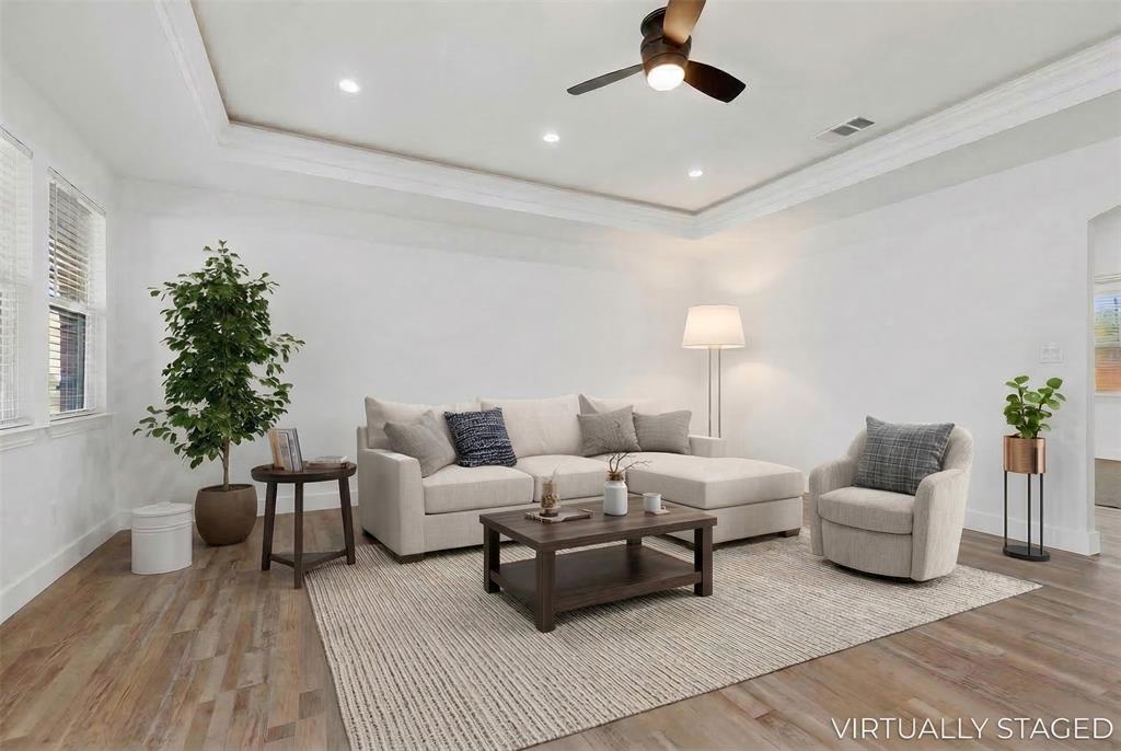 106 Jones Street Terrell, TX 75160 - Photo 5 of 26 a living room with furniture and a potted plant
