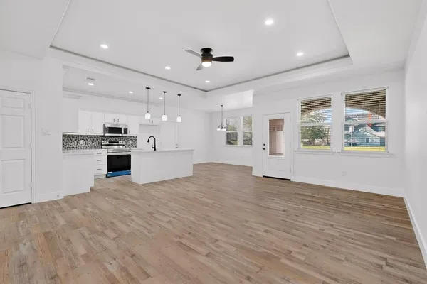 a view of a kitchen with microwave and stove
