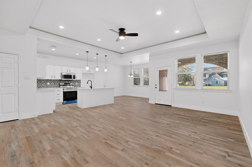 106 Jones Street Terrell, TX 75160 - Photo 6 of 26 a view of a kitchen with microwave and stove