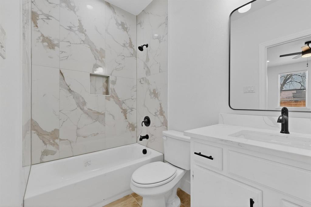 106 Jones Street Terrell, TX 75160 - Photo 10 of 26 a bathroom with a sink toilet and shower