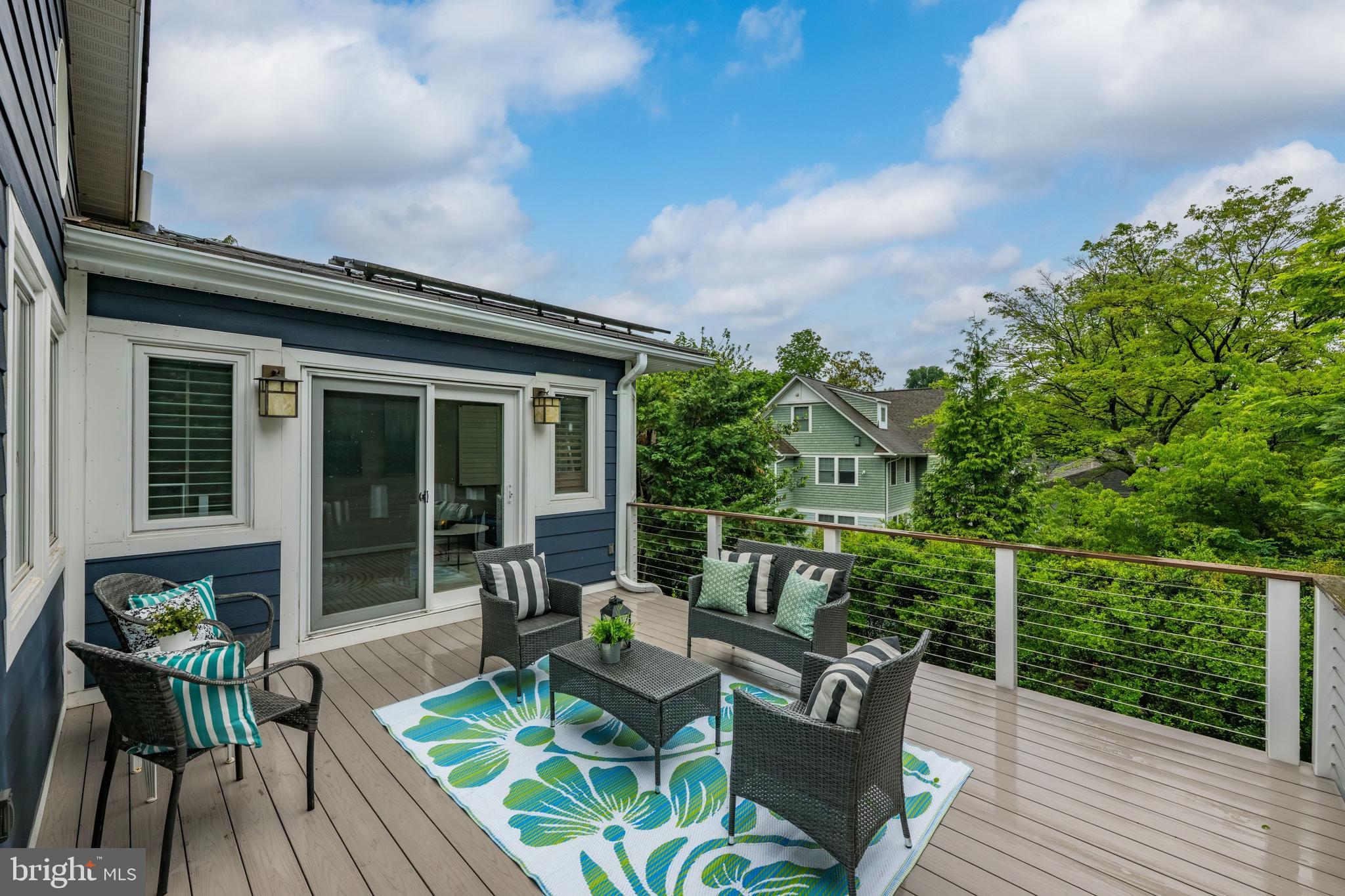 3529 Yuma Street Northwest Washington, DC 20008 - Photo 13 of 46 a view of a chair and table on the wooden deck