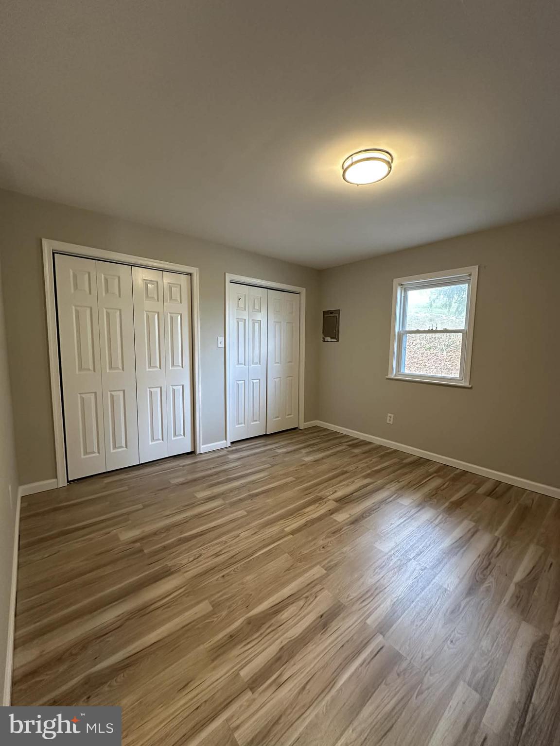 2642 Spring Road Chambersburg, PA 17202 - Photo 11 of 18 a view of an empty room with wooden floor and window