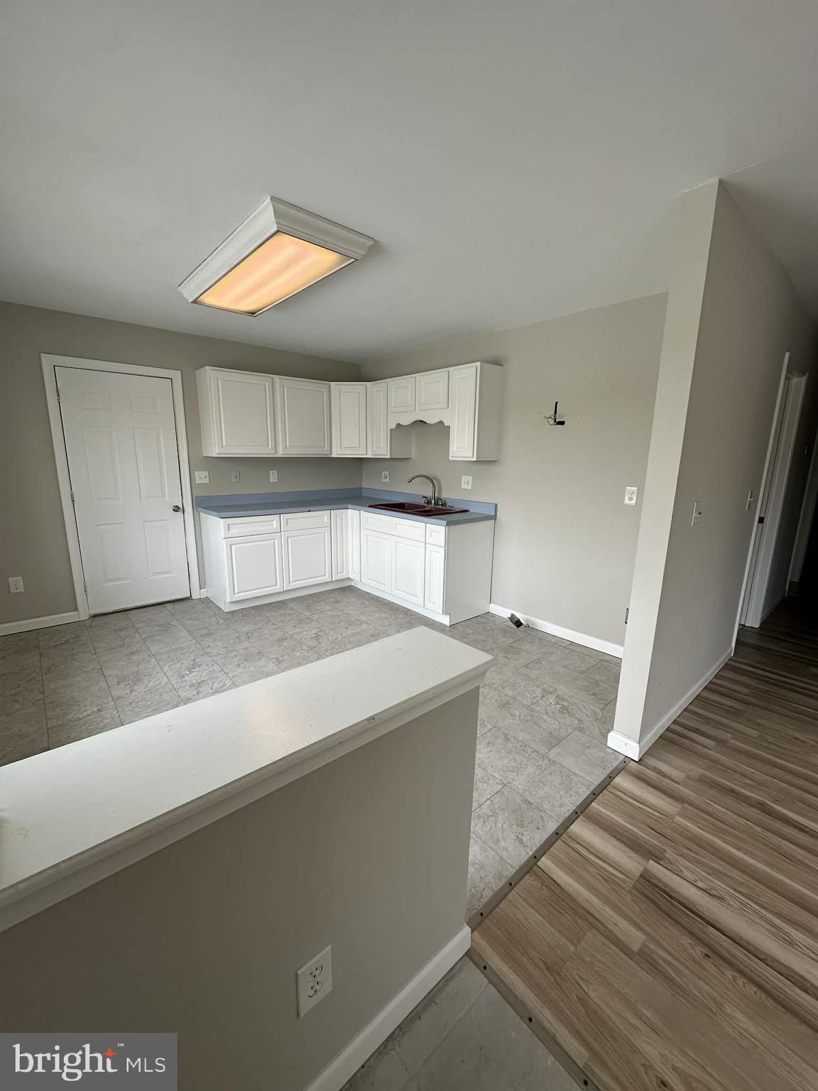 2642 Spring Road Chambersburg, PA 17202 - Photo 4 of 18 a view of a kitchen with a sink and a window