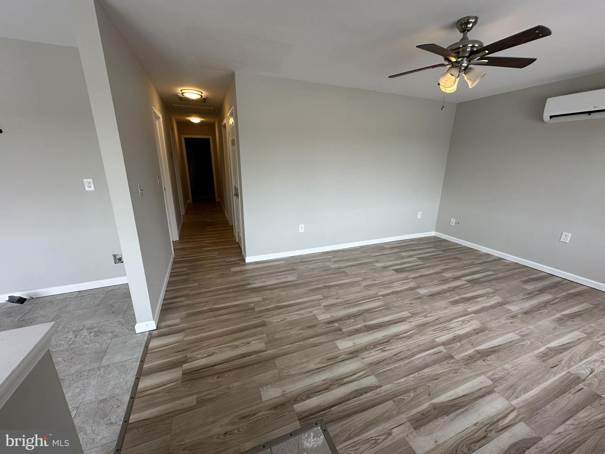 2642 Spring Road Chambersburg, PA 17202 - Photo 9 of 18 wooden floor in an empty room with a window