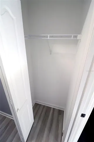 a bathroom with a sink toilet and mirror