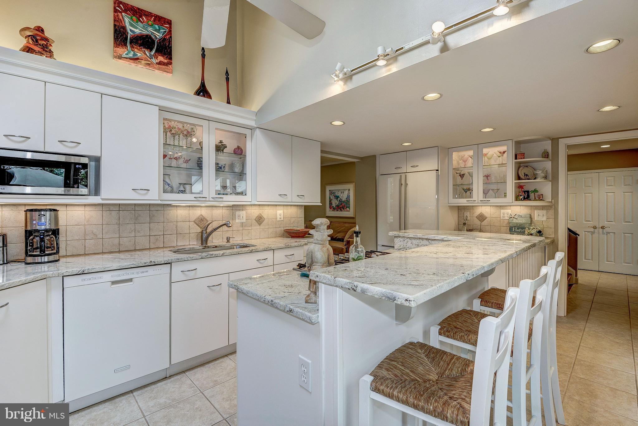 1636 Waters Edge Lane Reston, VA 20190 - Photo 14 of 30 a kitchen with a sink stove and cabinets