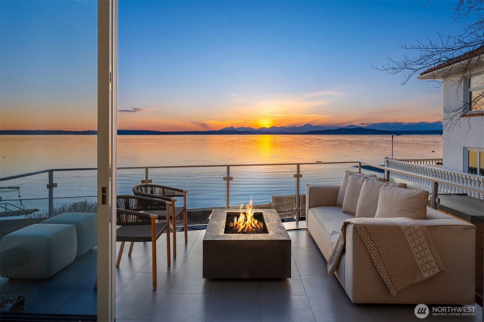 a balcony with furniture and city view