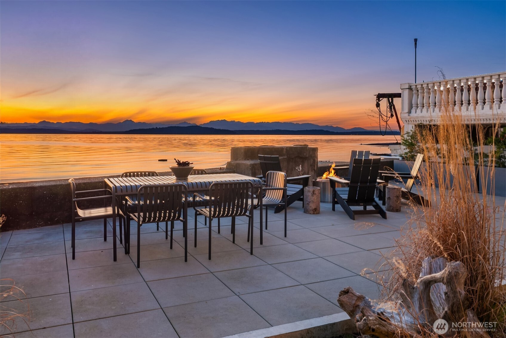 4717 Beach Drive Southwest Seattle, WA 98116 - Photo 9 of 11 a dining space with furniture and a ocean view