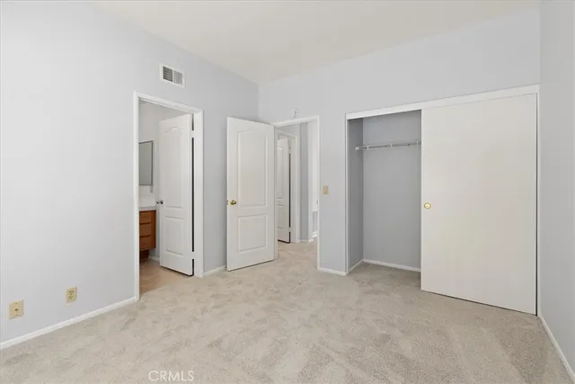 a view of a grassy field with mountains in the background