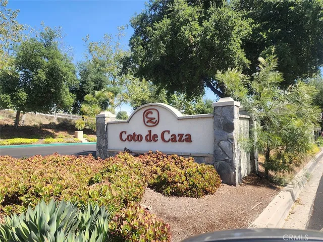 a view of a house with swimming pool and sitting area