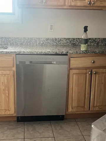 a kitchen with granite countertop cabinets and sink