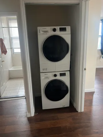 a view of a hallway with washer and dryer