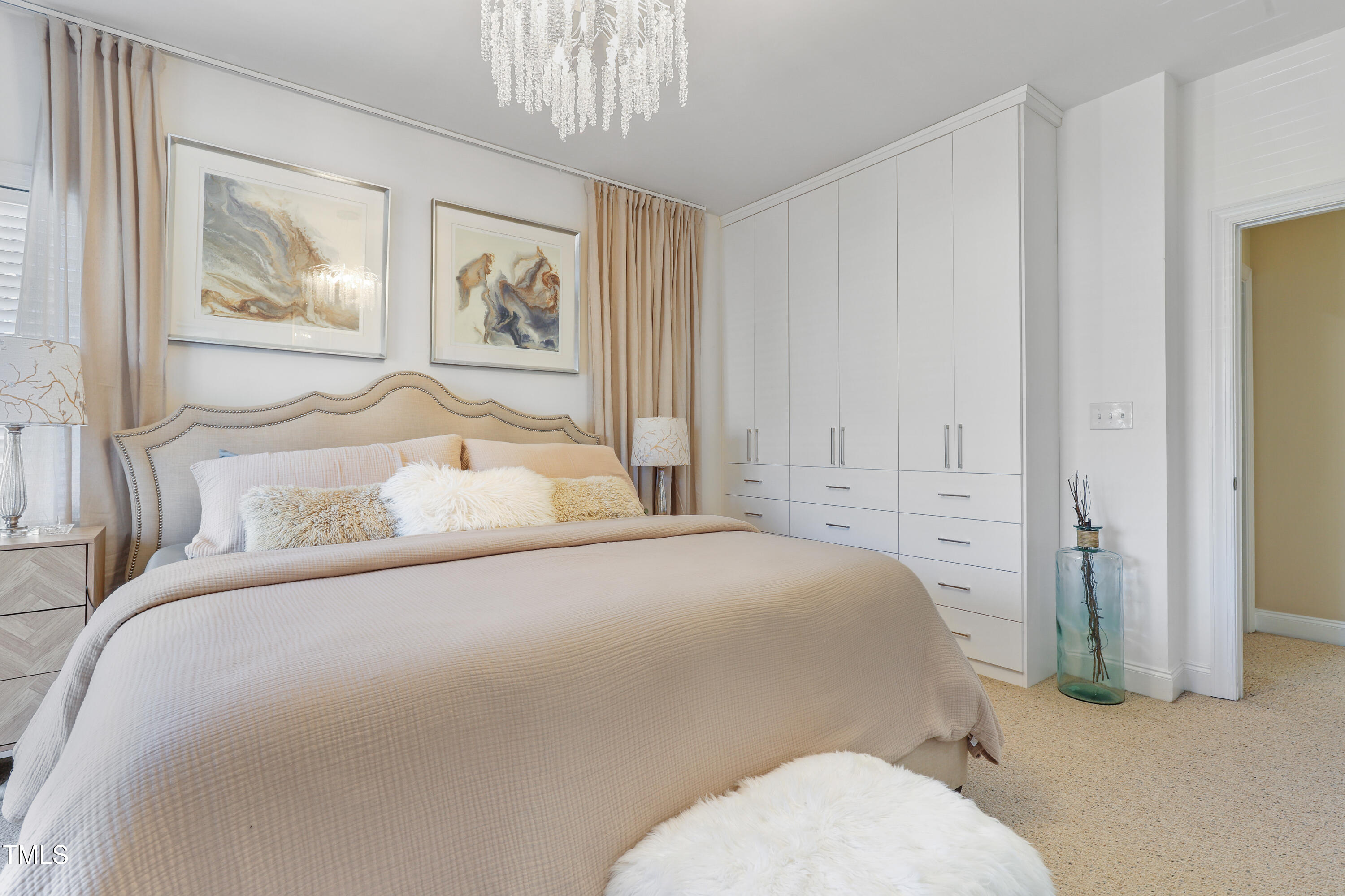 672 Highpark Lane Raleigh, NC 27608 - Photo 15 of 25 a bedroom with a bed and wall painting