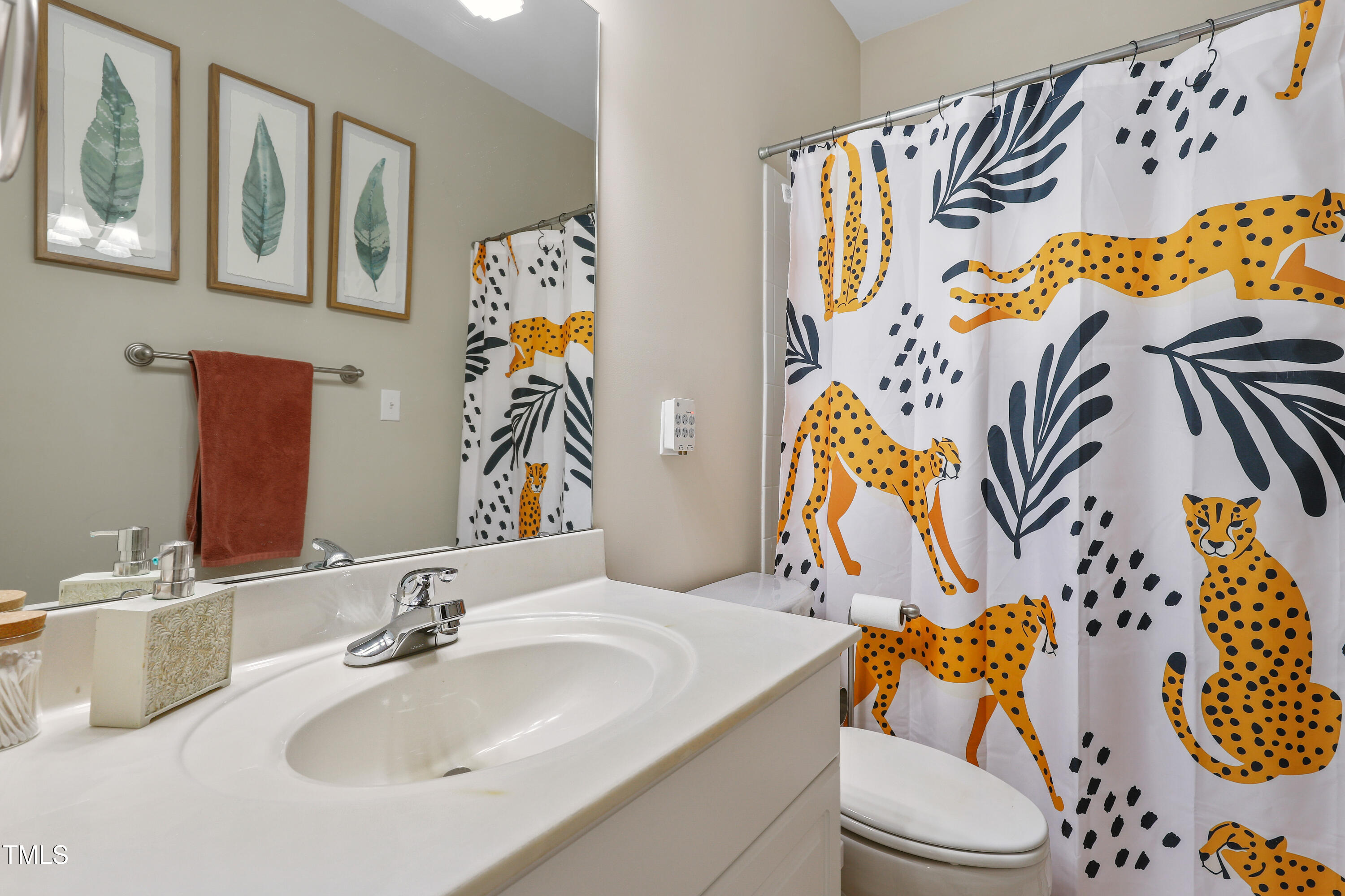 672 Highpark Lane Raleigh, NC 27608 - Photo 19 of 25 a bathroom with a sink mirror and vanity