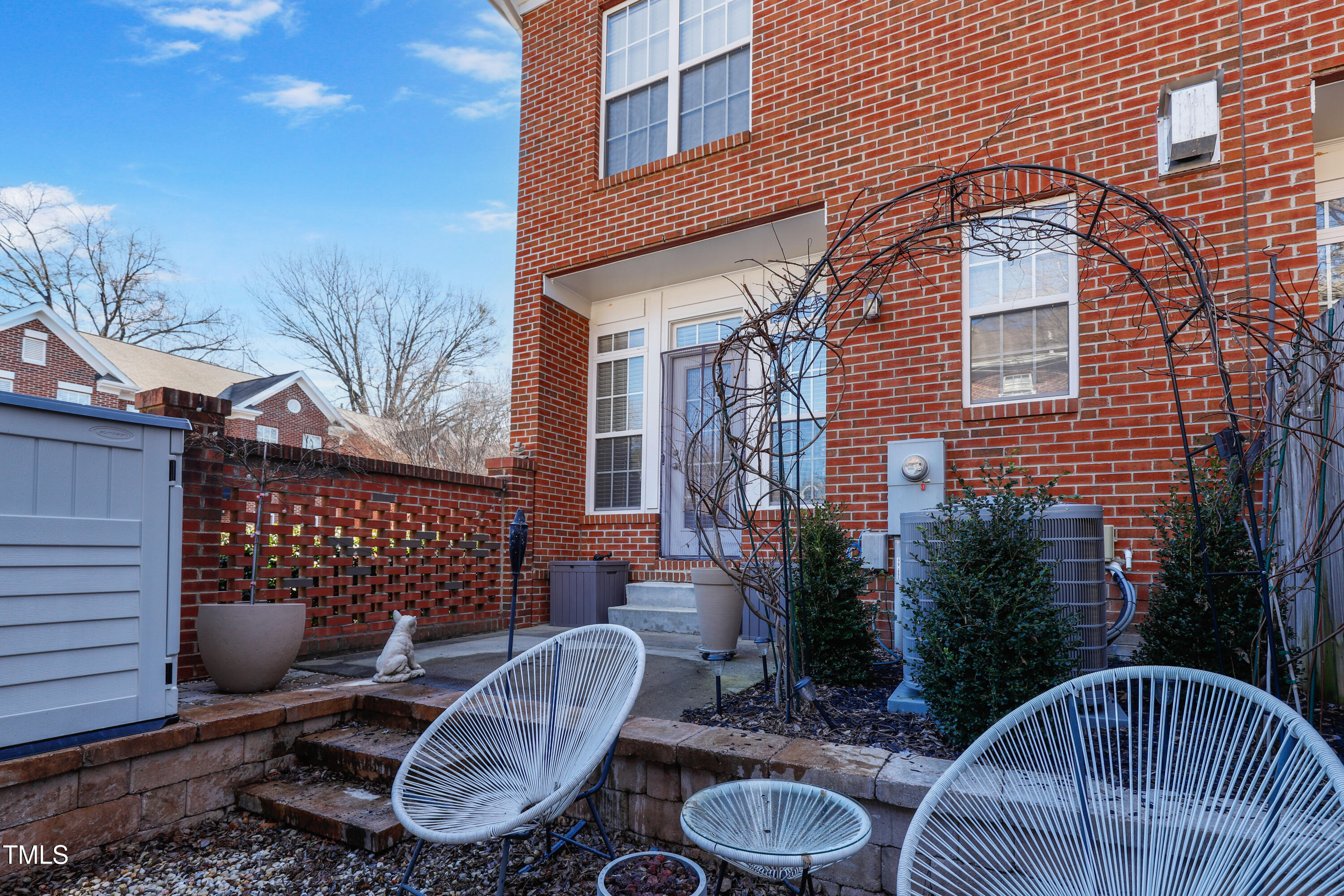 672 Highpark Lane Raleigh, NC 27608 - Photo 23 of 25 a backyard of a house with fire pit and outdoor seating