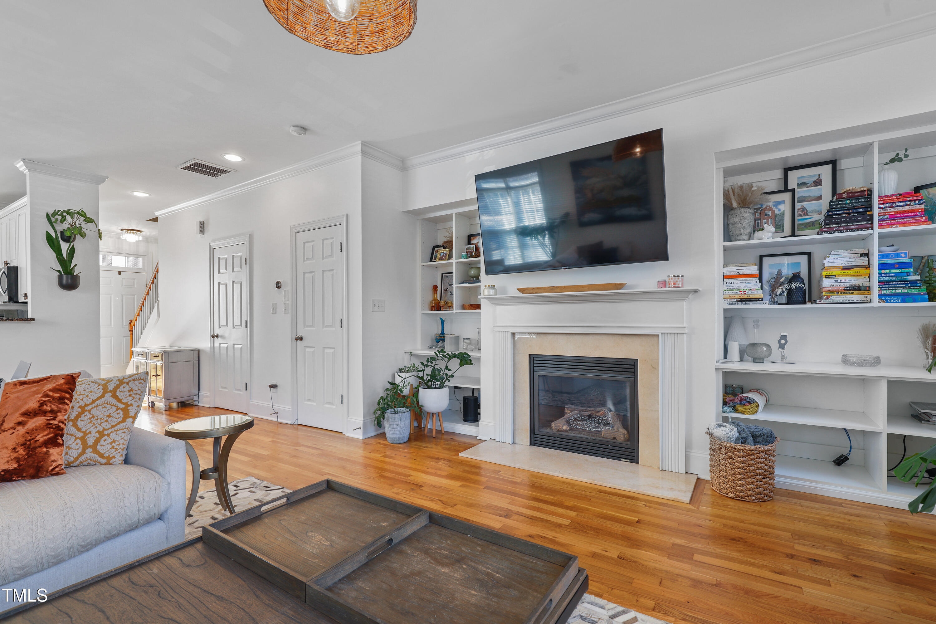 672 Highpark Lane Raleigh, NC 27608 - Photo 10 of 25 a living room with furniture fireplace and flat screen tv