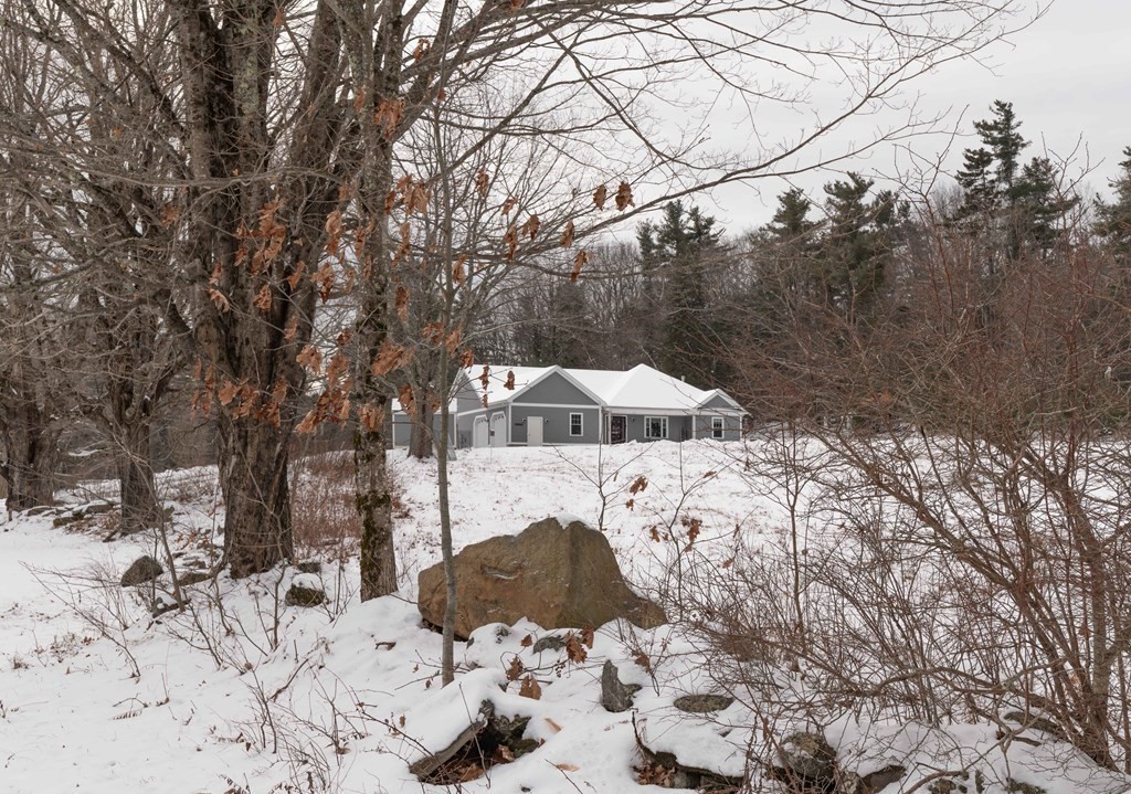 261 Old Chesterfield Road Chesterfield, MA 01096 - Photo 4 of 37 a view of roof covered with snow in front of house