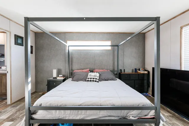 a bathroom with a bathtub and a window