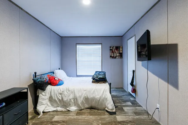 a bedroom with a bed and a closet