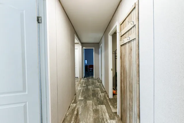 a kitchen with a refrigerator sink and cabinets
