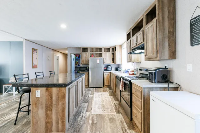 a couple of table and chairs sitting in an ocean
