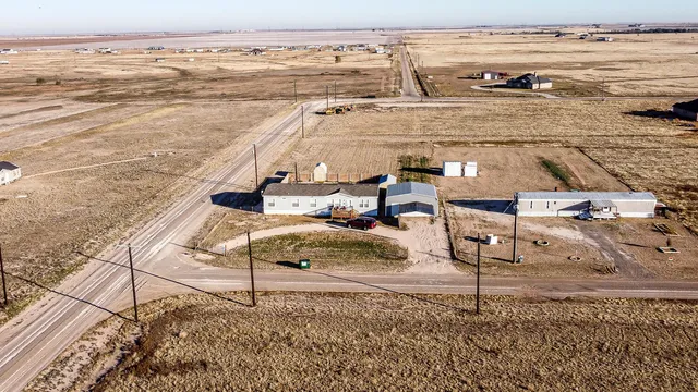 a bedroom with a bed and a flat tv screen
