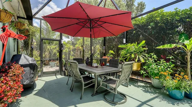 a patio with a patio table and chairs