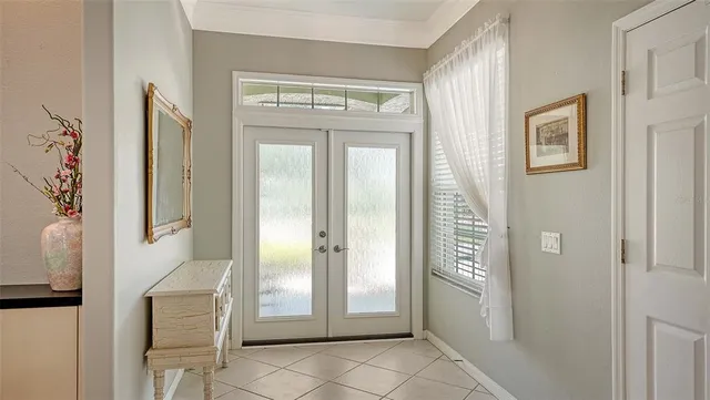 a view of a hallway with windows and closet