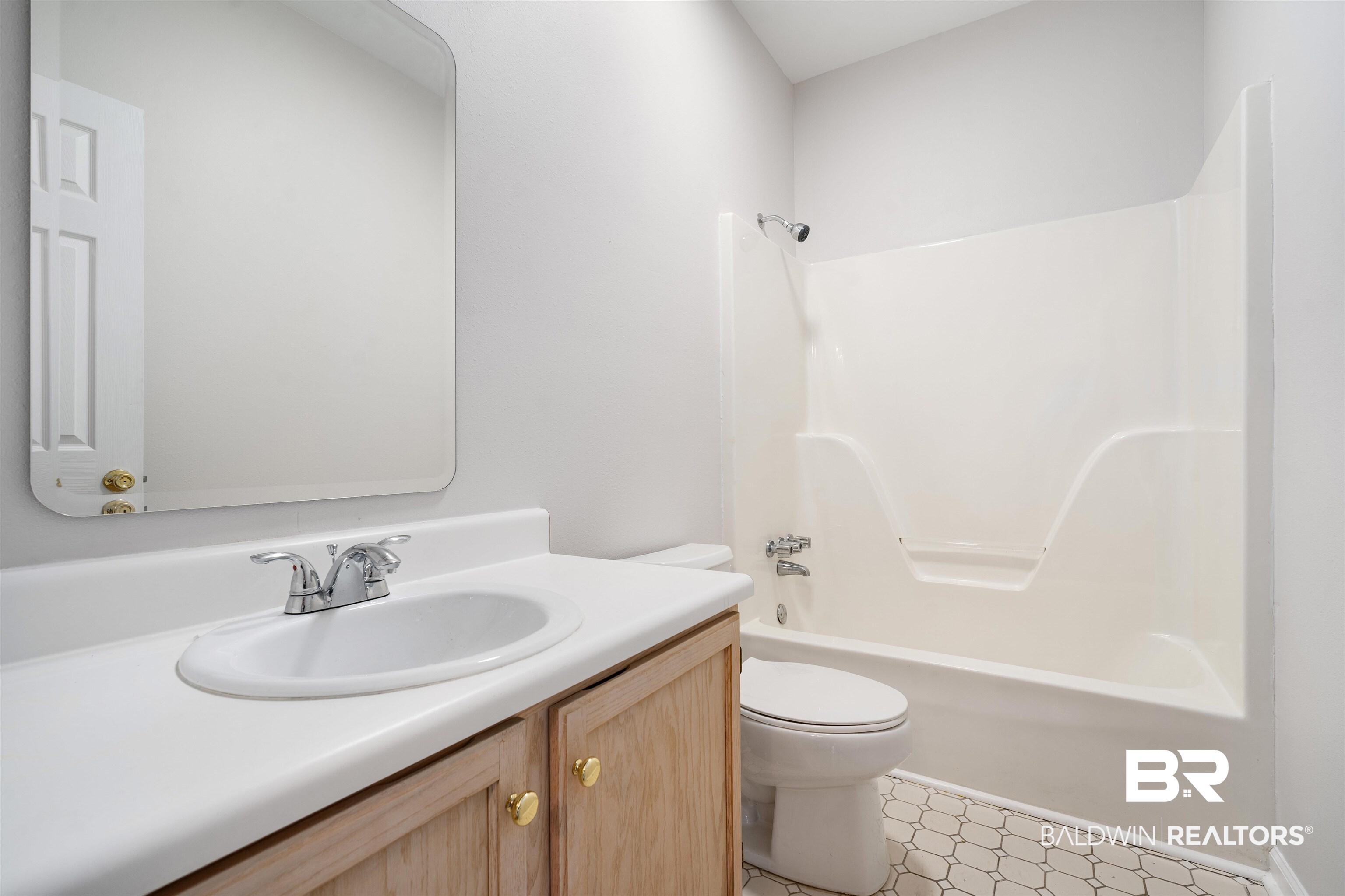 250 North Spring Lake Drive Mobile, AL 36695 - Photo 21 of 29 Full hall bathroom with vanity, shower / bathtub combination, and light floors