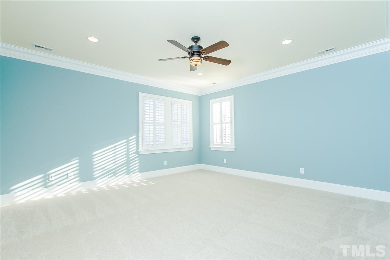 319 Perry Street Raleigh, NC 27608 - Photo 18 of 25 a view of a livingroom with a ceiling fan and window