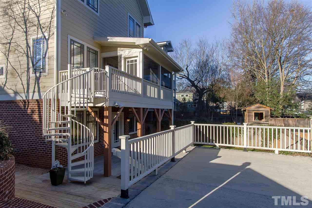 319 Perry Street Raleigh, NC 27608 - Photo 24 of 25 a view of a house with a wooden deck
