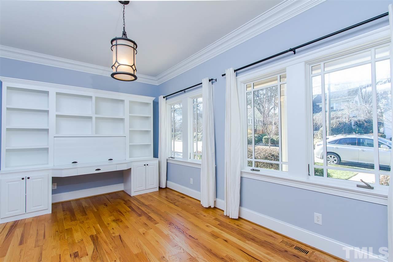 319 Perry Street Raleigh, NC 27608 - Photo 3 of 25 a bedroom with a bed and a window