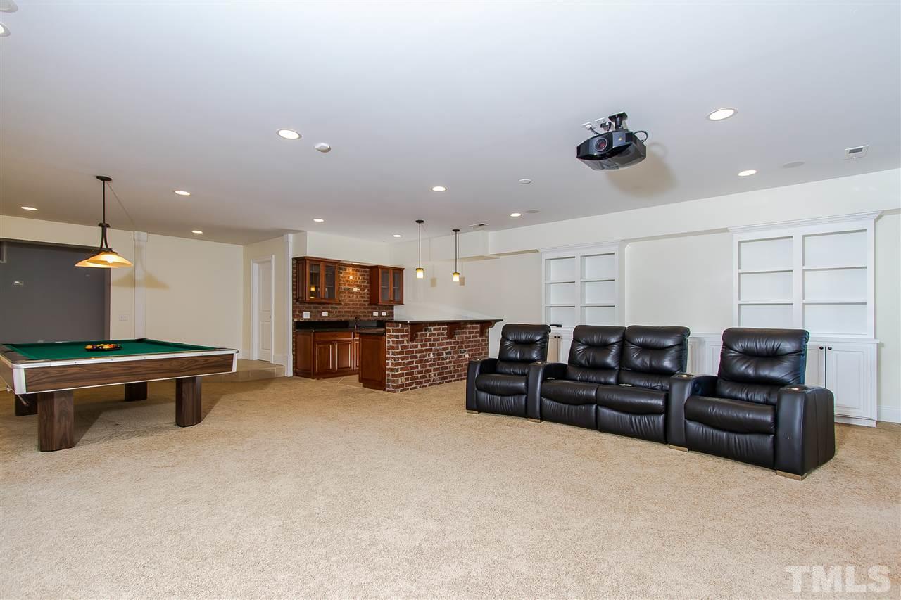 319 Perry Street Raleigh, NC 27608 - Photo 9 of 25 a living room with furniture and a flat screen tv
